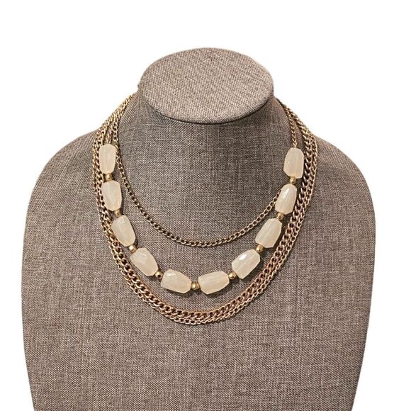 Sophia's Golden Elegance: A Four-Layered White Stone Bead Statement Necklace - Picture 9 of 10